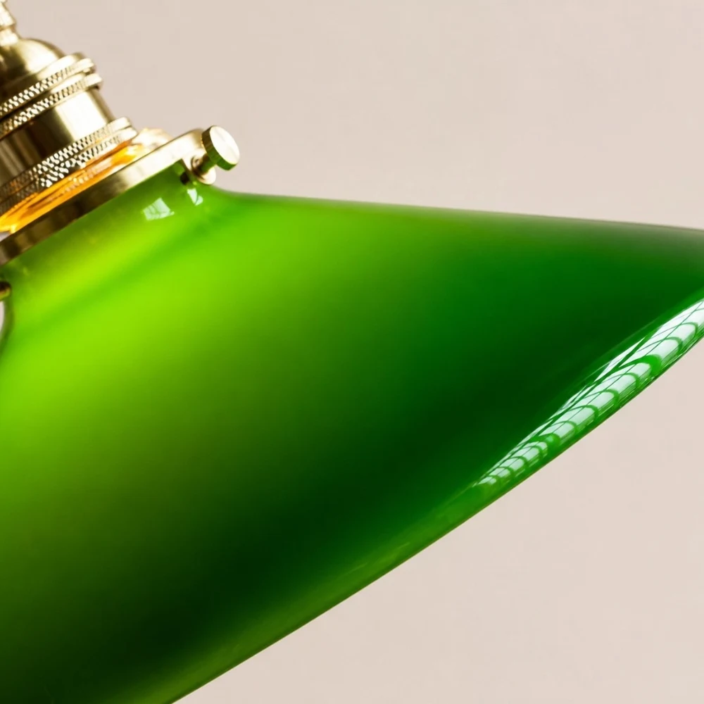 Cone green glass pendant lamp rim and brass hardware detail