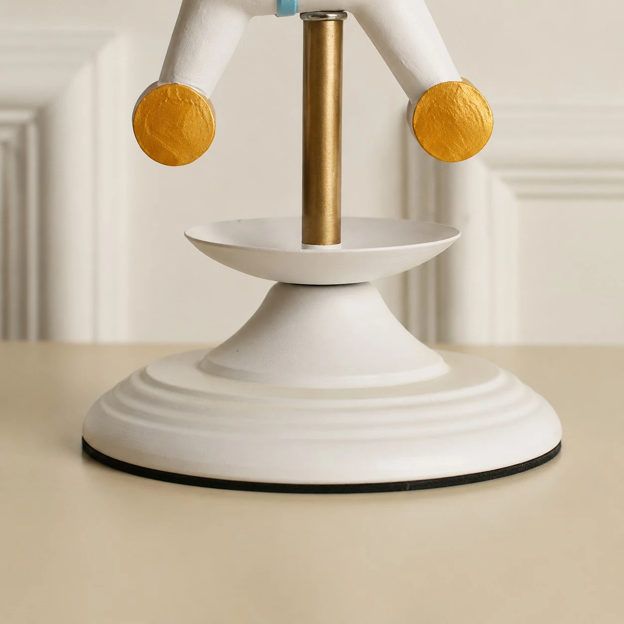White lamp base and brass stem detail