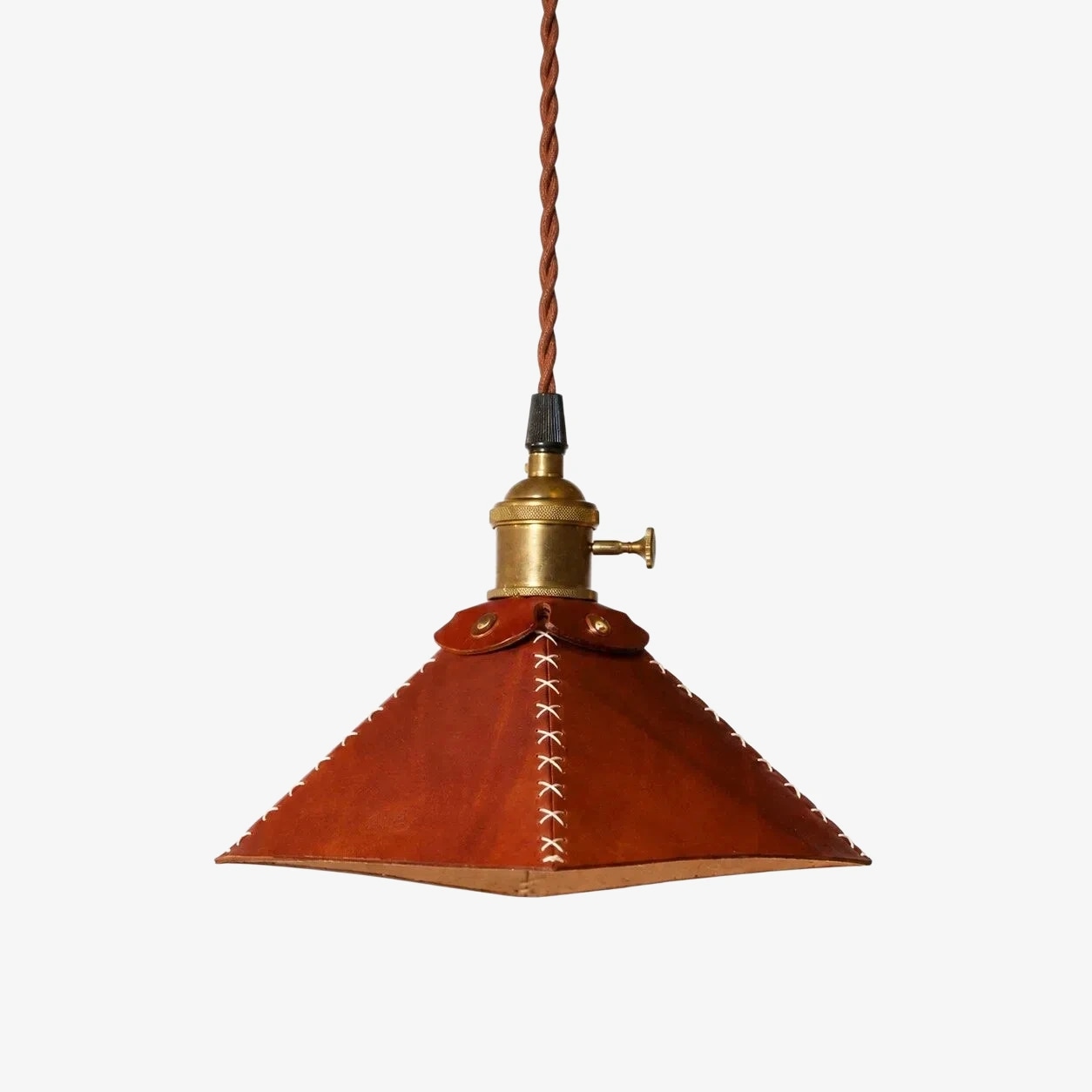 Selected leather pyramid pendant lamp on white background