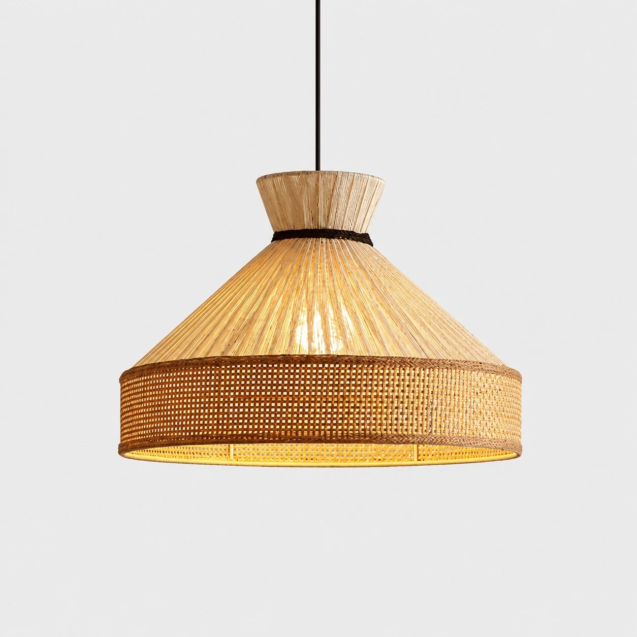 Shade A woven fabric cone pendant light with warm glow