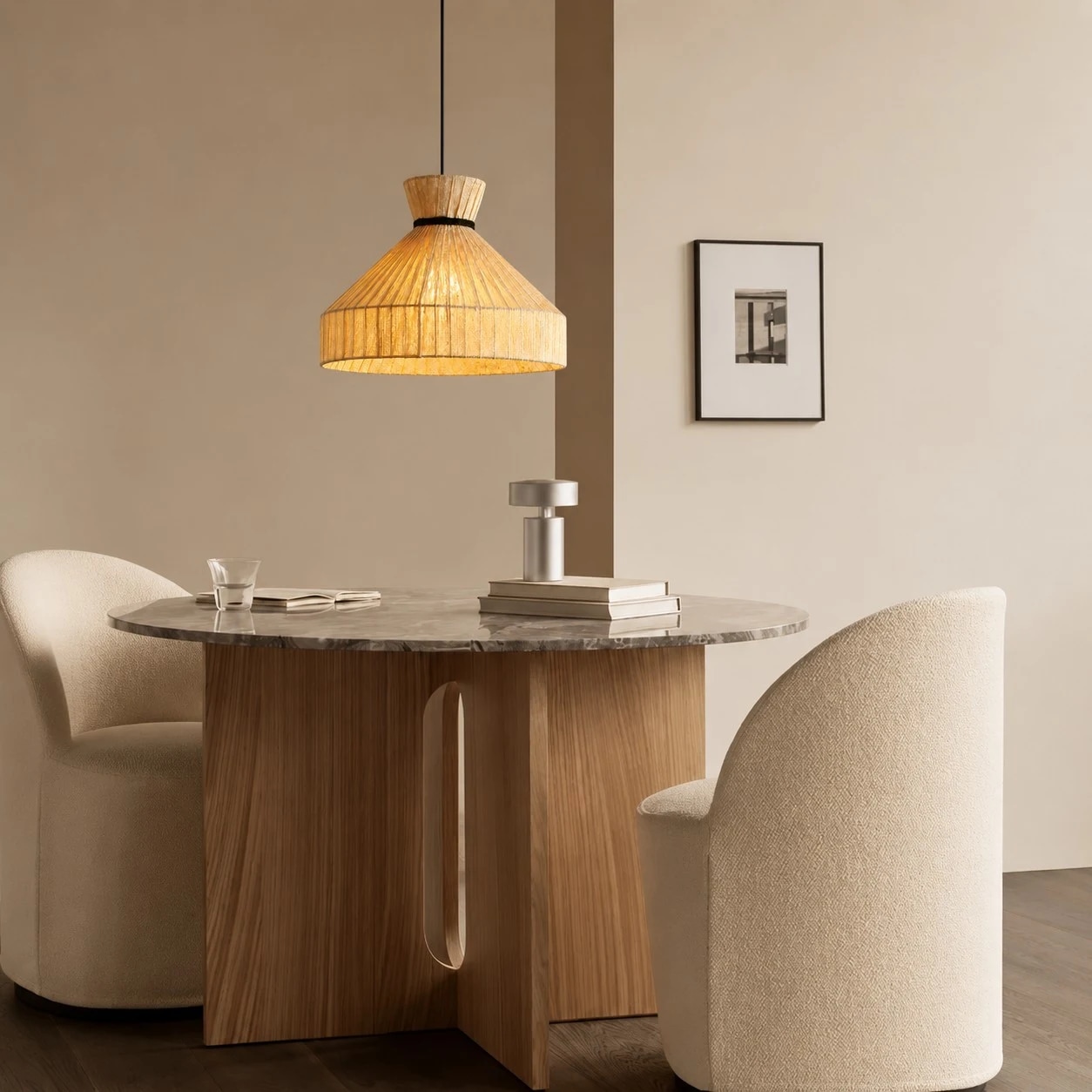 Fabric cone pendant light above a round dining table