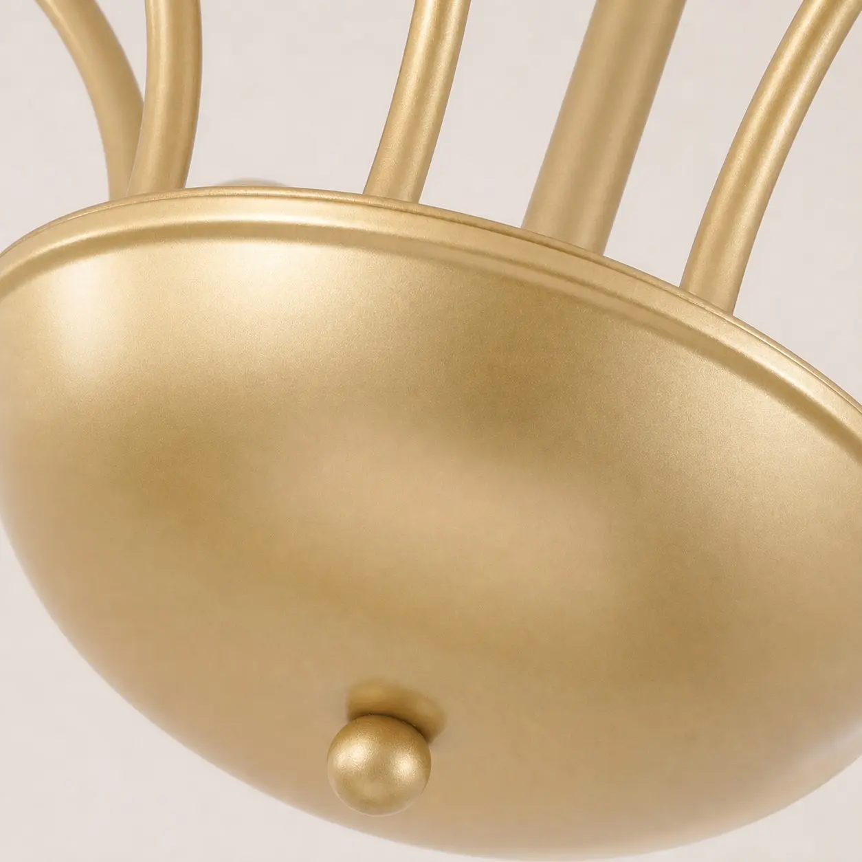 Close-up of the chandelier's satin gold metal finish