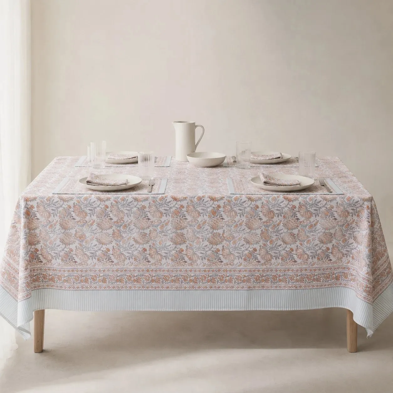 Mist blue floral tablecloth on a dining table