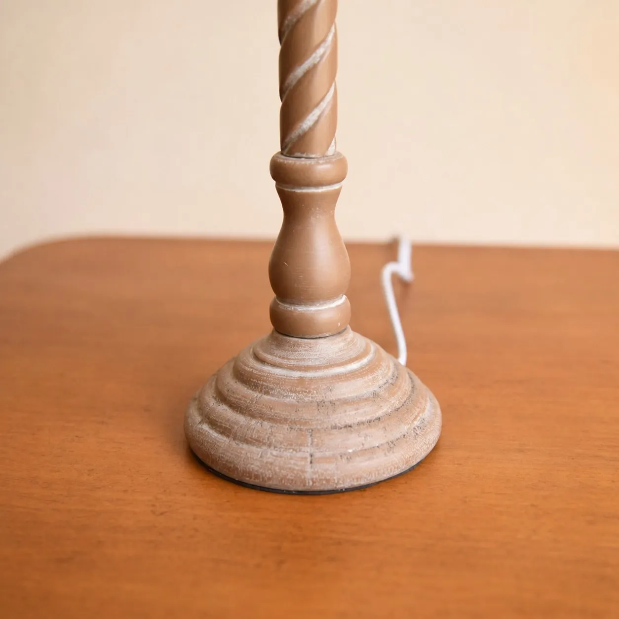 Carved wooden table lamp base close detail