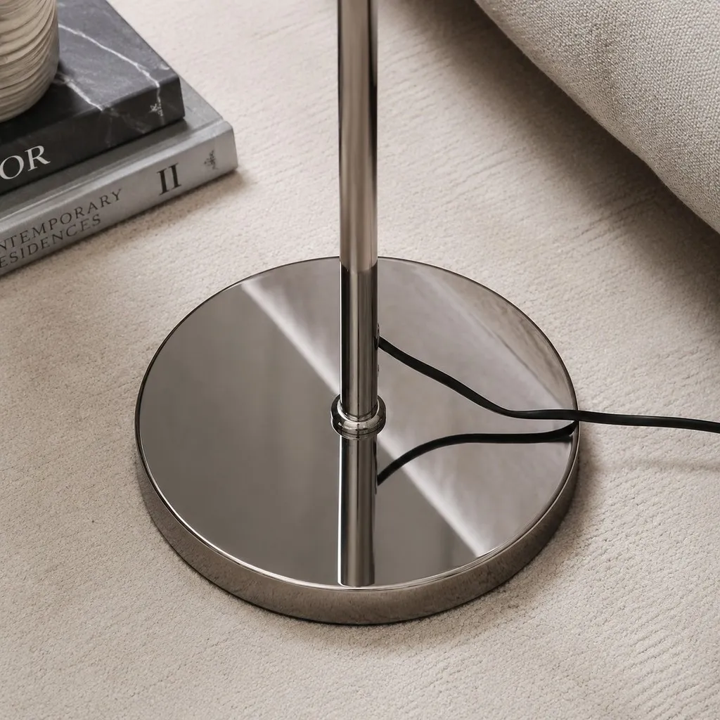 Polished chrome floor lamp base and stem detail