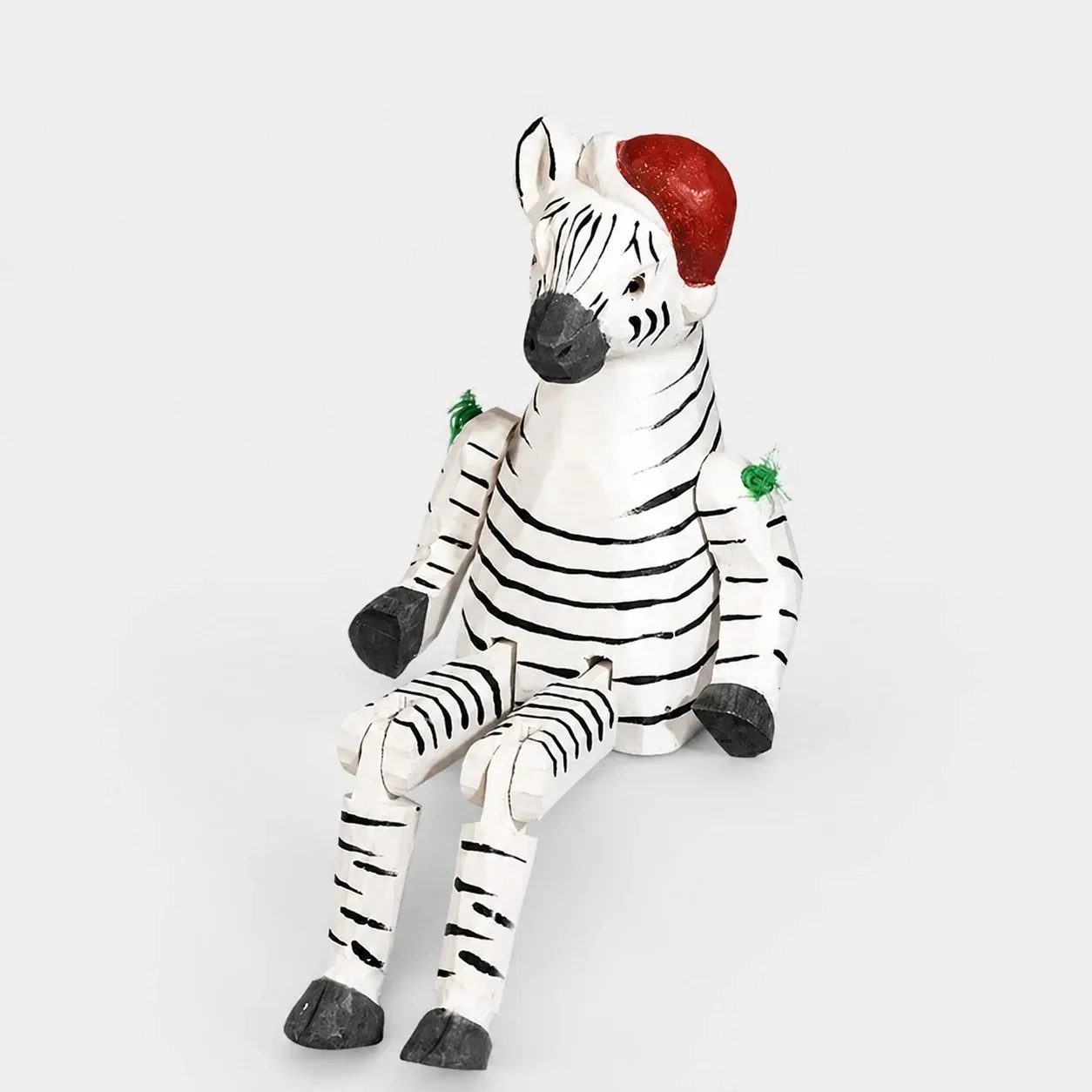 Hand-carved wooden zebra with santa hat ornament