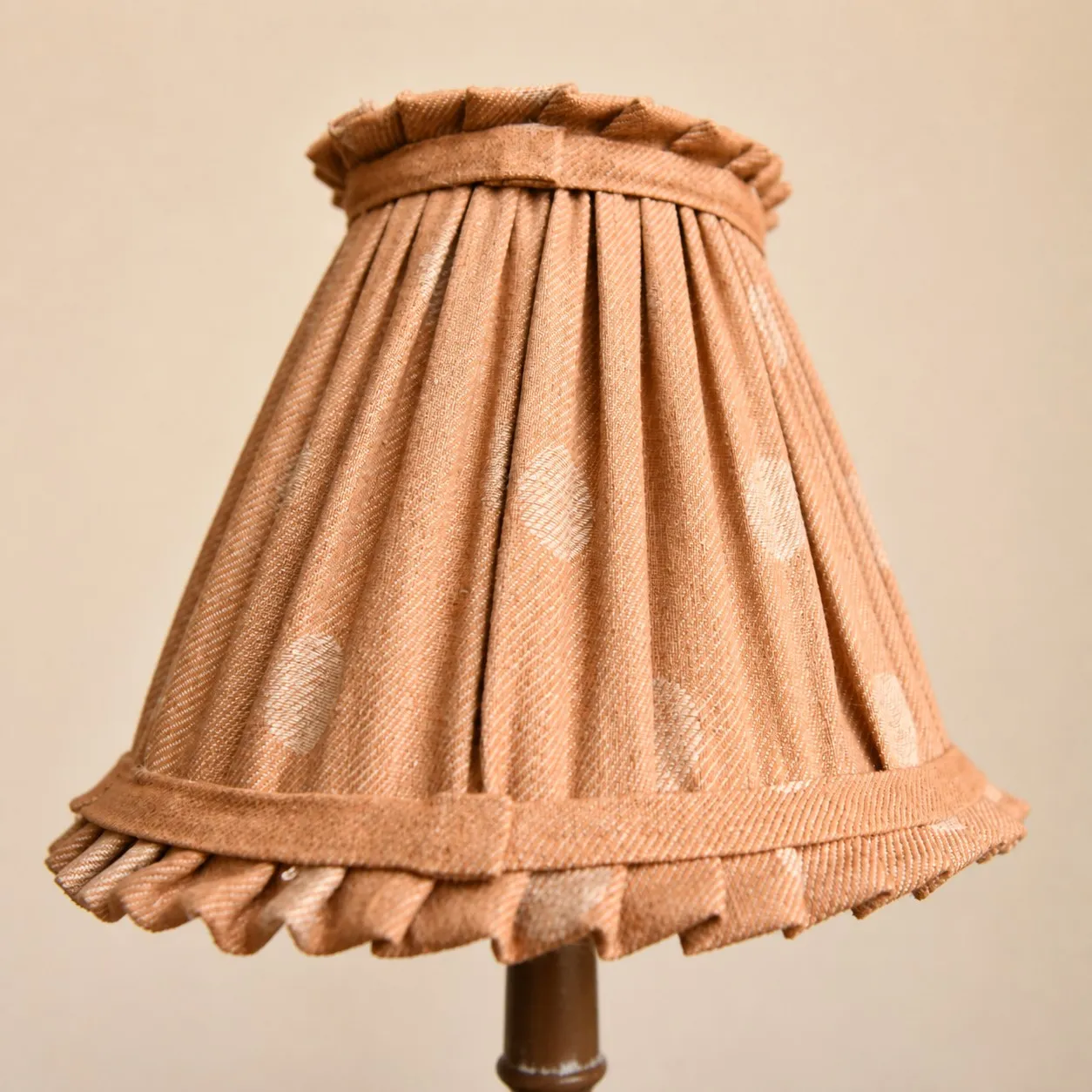 Pleated cloth lampshade close detail on French country table lamp
